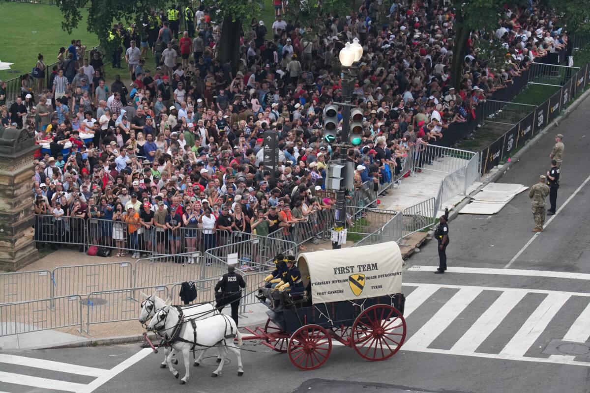 Visitors watch a parade and celebration marking the 250th birthday of the U.S. Army in Washington on June 14, 2025. (Kevin Dietsch/Getty Images)