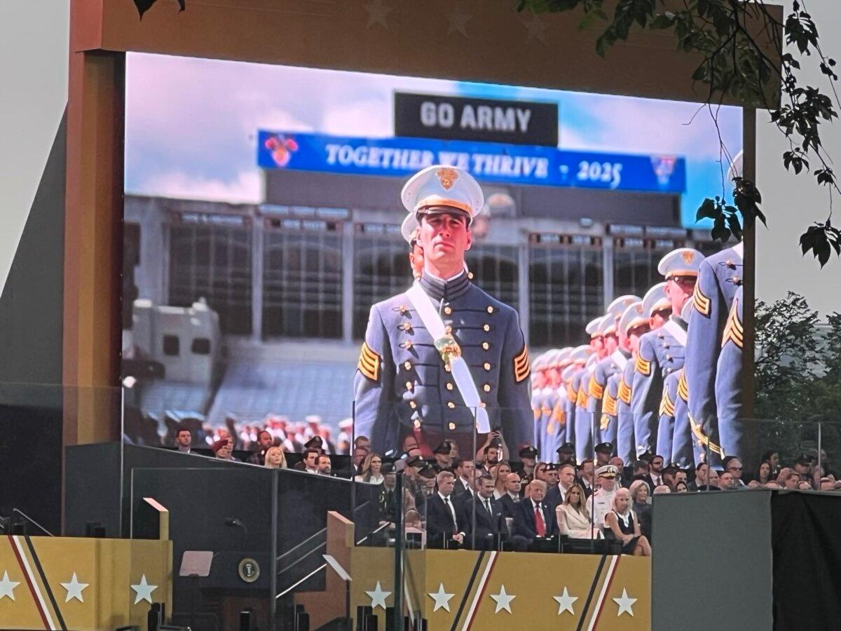 President Donald Trump watches a parade marking the 250th birthday of the Army in Washington on June 14, 2025. (Epoch Times)