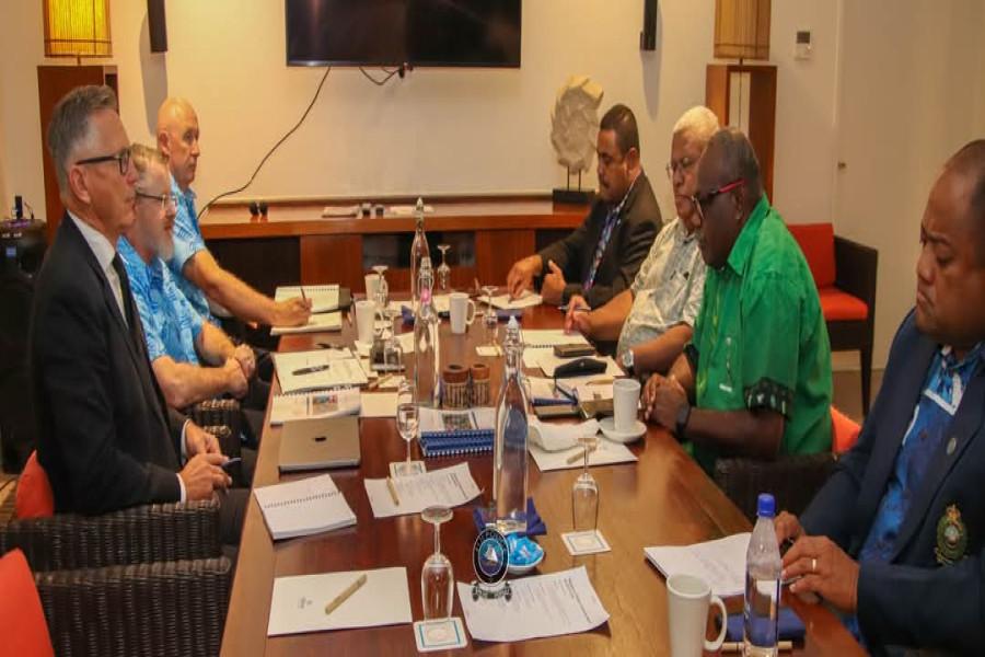 The AFP team responsible for a review of Fiji's police, including Australian Federal Police Assistant Commissioner Nigel Ryan and consultant Mike Bush, meet with senior Fijian officers. (Courtesy of Fiji Police)