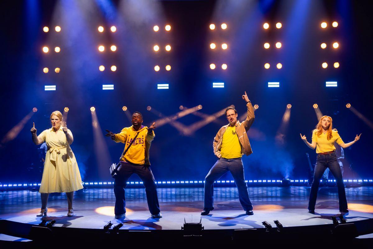 Lisa Howard as Margaret Van Deusen, Akron Watson as Ron Richland, Charlie McCullagh as Larry Walters, and Evelyn Hoskins as Carol Van Deusen in Chicago Shakespeare’s North American premiere production of "42 Balloons." (Kyle Flubacker)