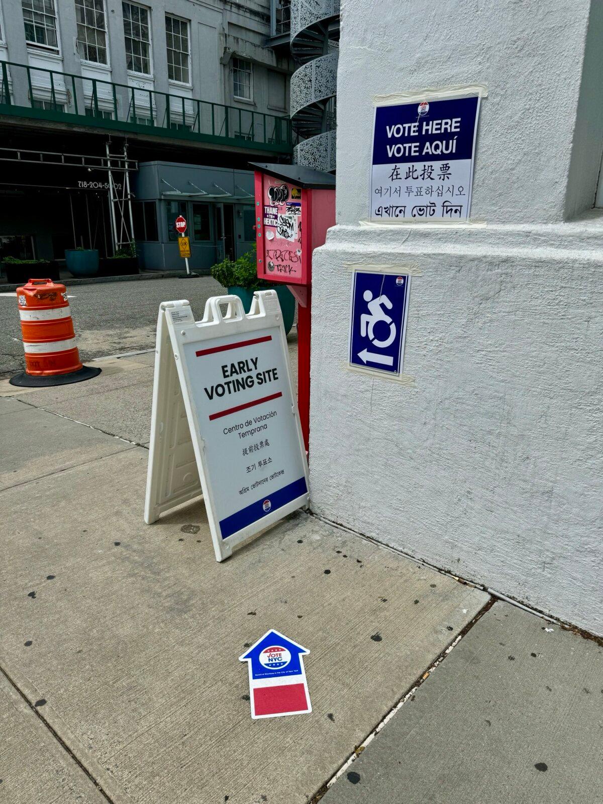 Signs in multiple languages are displayed outside a polling location in Astoria, Queens, N.Y., during the primary. (Arjun Singh/The Epoch Times)
