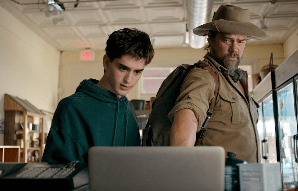 Chase (Michael Zapesotsky, L) being tutored by Guy (Josh Duhamel),  in "Off the Grid." (Lionsgate Films)