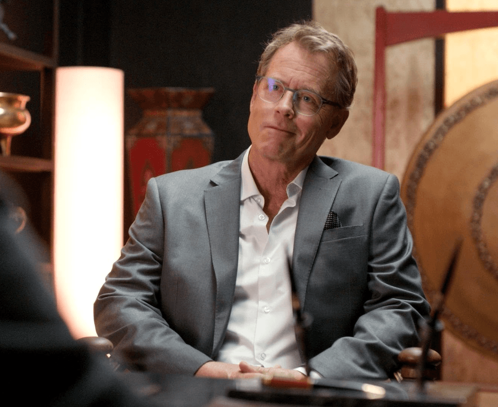 Ranish (Greg Kinnear) is not thrilled about being tasked with chasing a former employee into a swamp, in "Off the Grid." (Lionsgate Films)