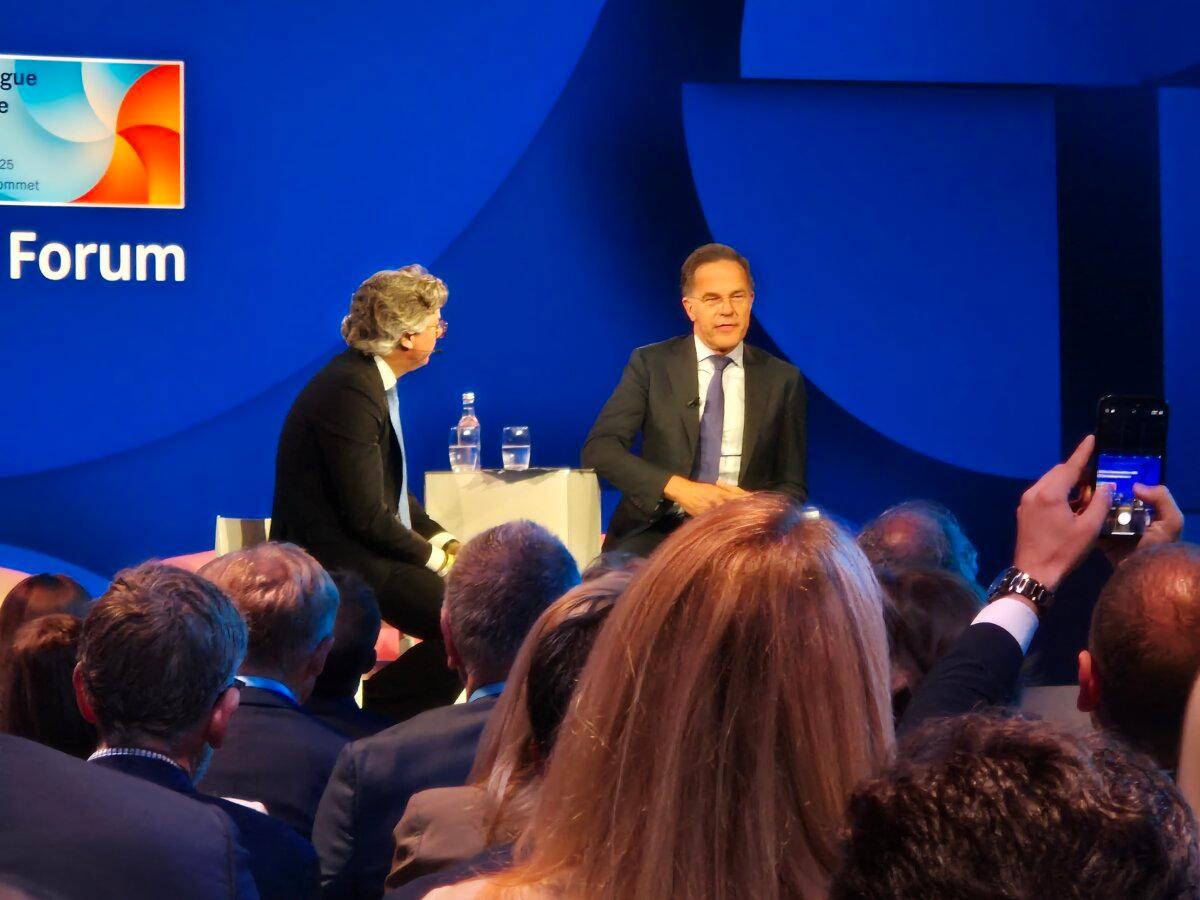 NATO Secretary-General Mark Rutte (R) in conversation with Benedikt Franke (L) at the NATO Public Forum in The Hague, Netherlands, on June 24, 2025. (Chris Summers/The Epoch Times)