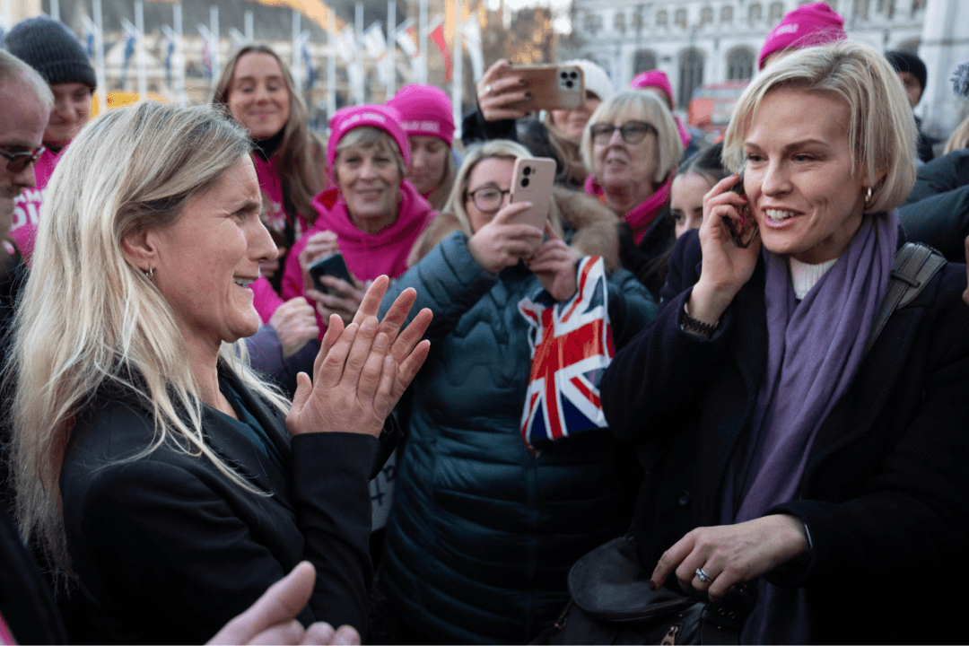 Kim Leadbeater (left) is joined by Esther Rantzen’s daughter, Rebecca Wilcox (right), in Parliament Square after hearing the result of the vote in parliament for her Terminally Ill Adults (End of Life) Bill, in London, England, on Nov. 29, 2024. (Stefan Rousseau/PA Wire)