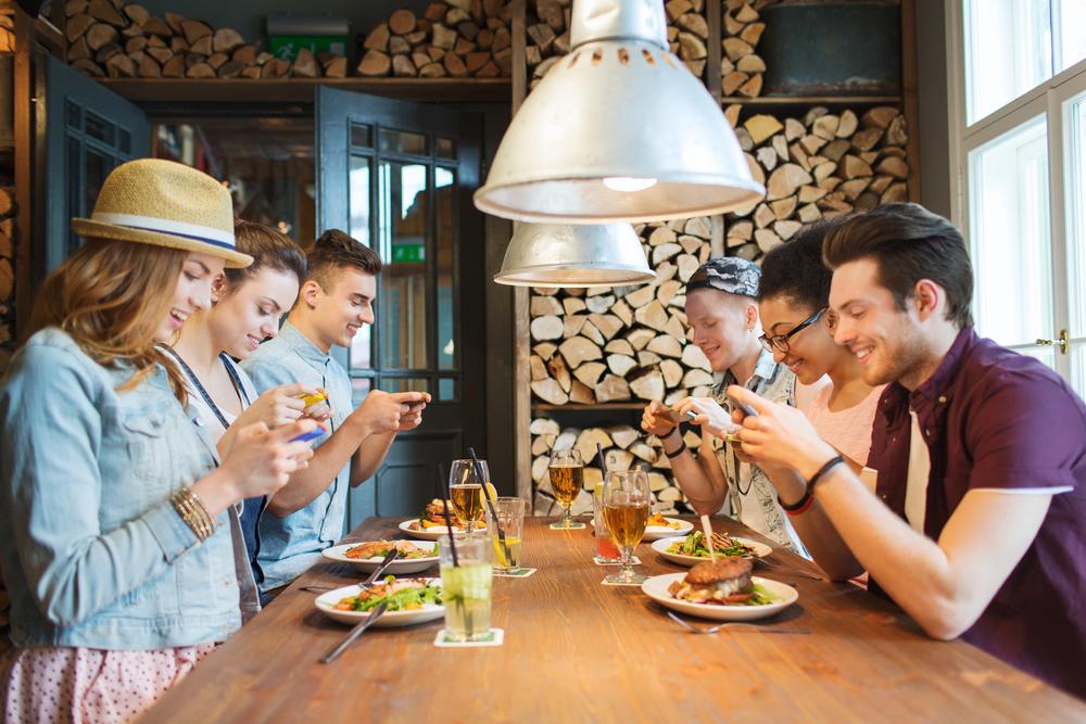 Cellphones can interfere with friendships and family relationships. (Ground Pictures/Shutterstock)