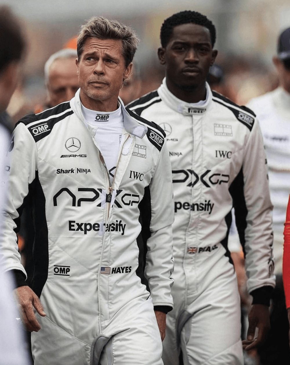 Sonny Hayes (Brad Pitt, L) and his younger teammate, Joshua Pearce (Damson Idris), in "F1: The Movie." (Warner Bros. Pictures)