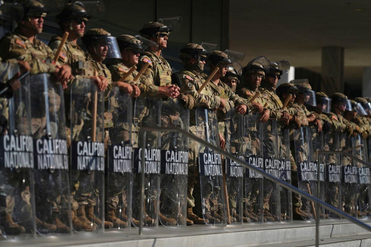 California National Guard members guard the federal building in downtown Los Angeles on June 10, 2025. (AP Photo/Eric Thayer)