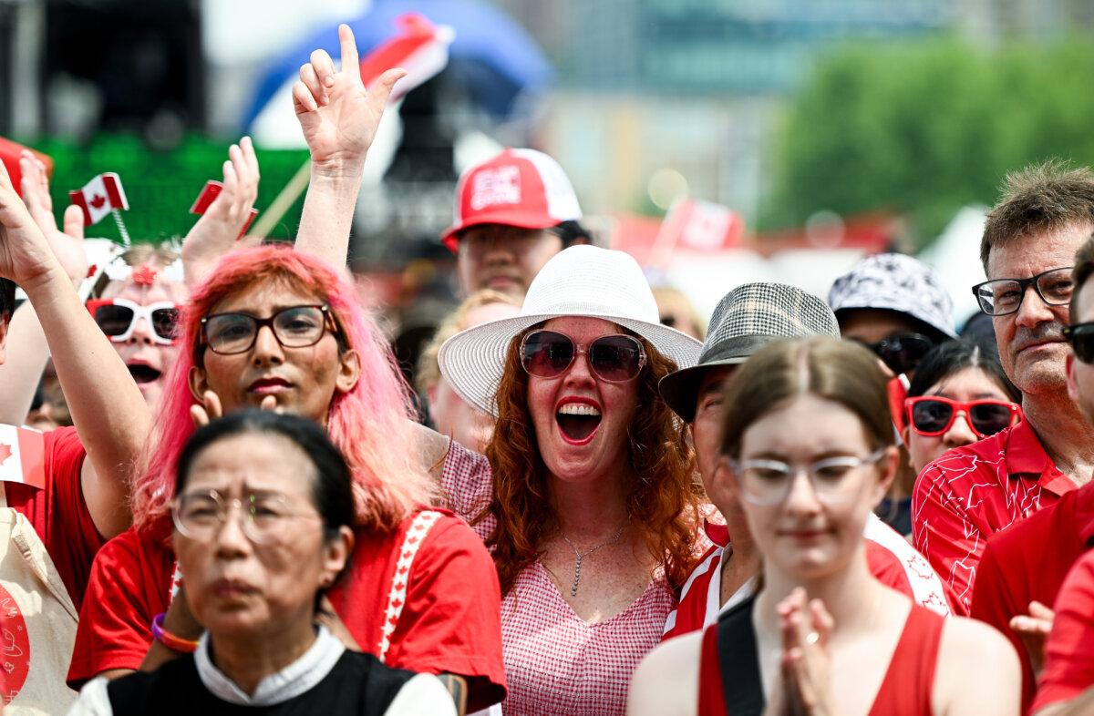 Spectators take part in Canada Day celebrations at LeBreton Flats in Ottawa, on July 1, 2025. (The Canadian Press/Spencer Colby)