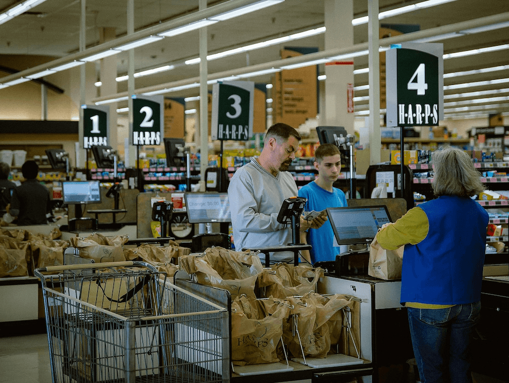 Jerry Kane (Nick Offerman, L) and his son Joe (Jacob Tremblay) get supplies, in "Sovereign." (Briarcliff Entertainment)