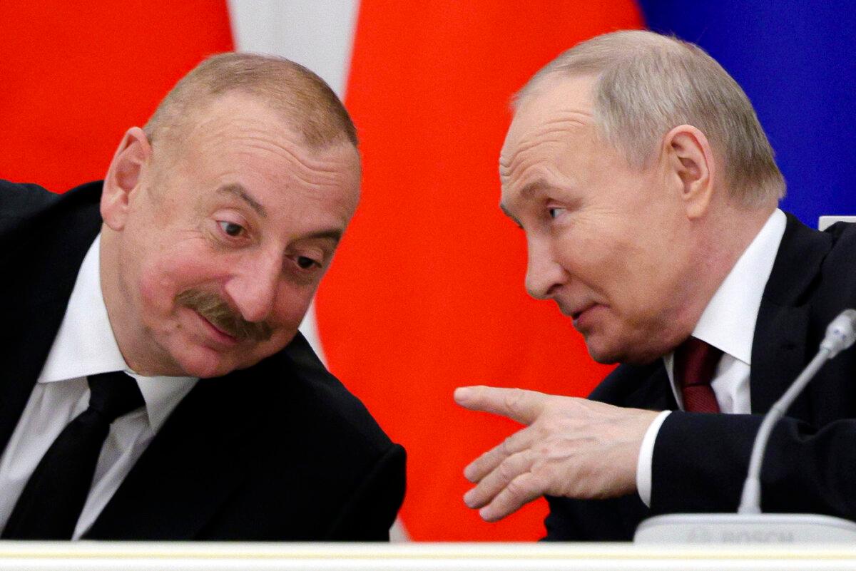 Russian President Vladimir Putin (R) and Azerbaijani President Ilham Aliyev meet at the Kremlin on April 22, 2024. (Gavriil Grigorov, Sputnik, Kremlin Photo via AP)