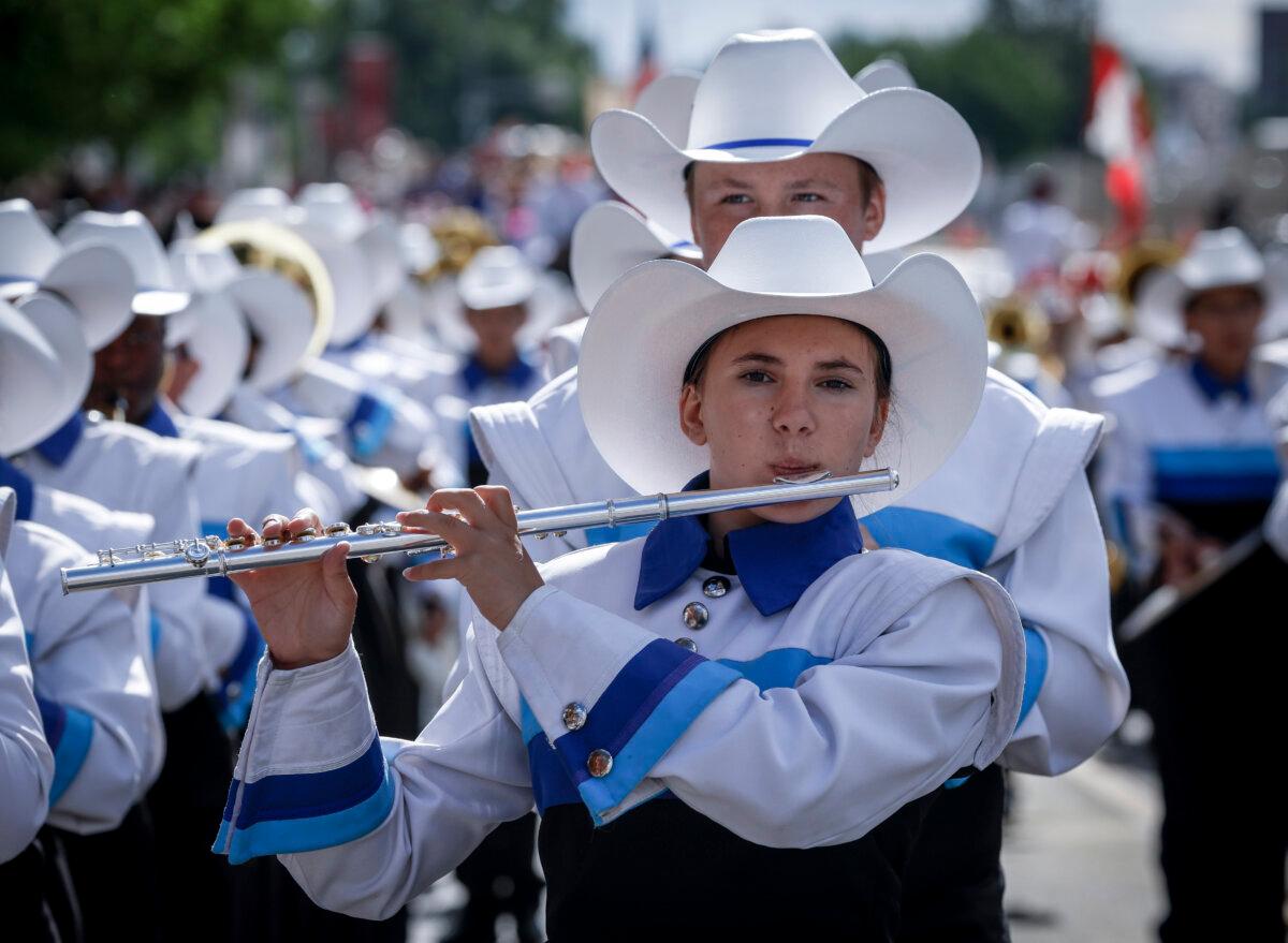 A marching band preforms during the Calgary Stampede parade on July 4, 2025. (The Canadian Press/Jeff McIntosh)