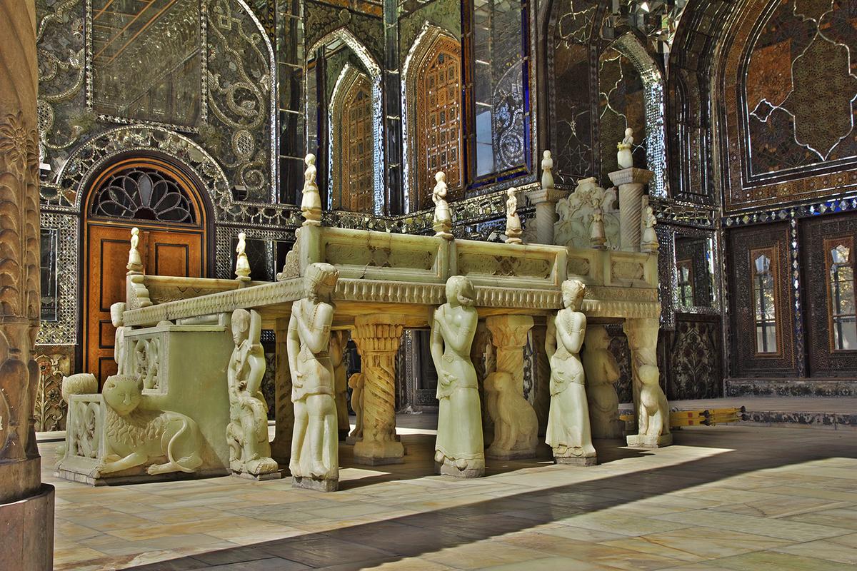 The marble throne, located in an iwan (a three-walled, vaulted pavilion), is one of the palace’s most iconic structures. The 19th-century throne, modeled after Persepolis, was made from 65 pieces of yellow marble quarried from the Yazd Province of Iran. The throne’s legs, which are sculptured figures that resemble people carrying a seated monarch, resemble Iranian paintings, while the carved detailing exemplifies classical Baroque influences. (Sergey-73/Shutterstock)