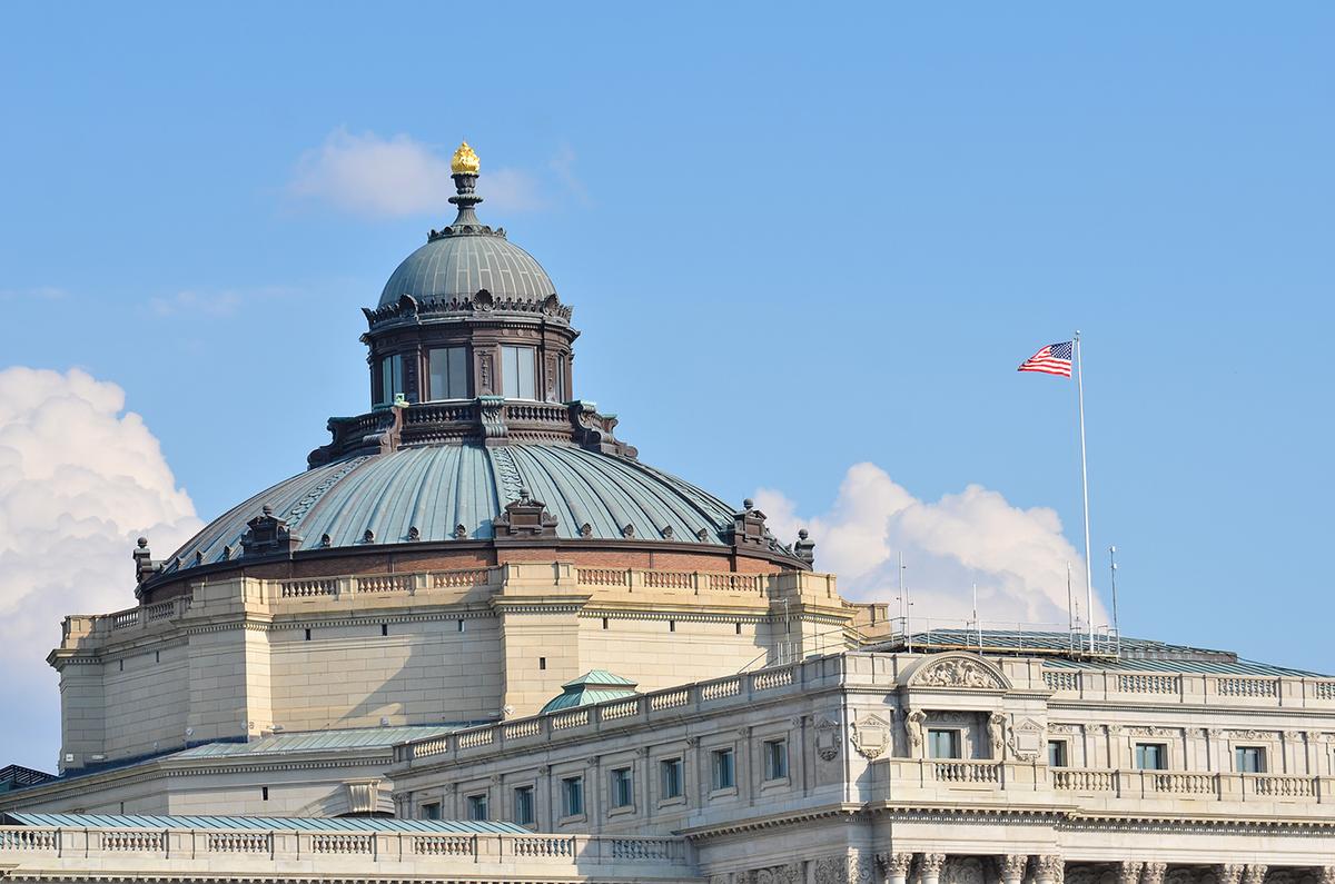 While they are now copper, the roof’s dome and cupola on the main building were originally covered in gold leaf. Out of sight of the general public are details galore: classic dentil moldings and balustrades of carved granite; bronze pediments; corbels; and scallop designs. Around the dome and the cupola are observation towers. A shell design in copper embellishes the cupola like a crown. What can be seen from street level is the gilded “Flame of Knowledge” motif adorning the dome. (Orhan Cam/Shutterstock)