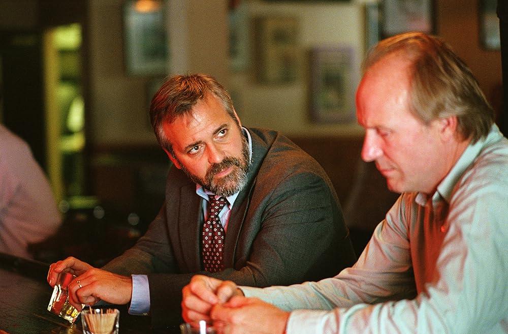 Bob Barnes (George Clooney, L) and Stan (William Hurt), in "Syriana." (Warner Bros. Pictures)