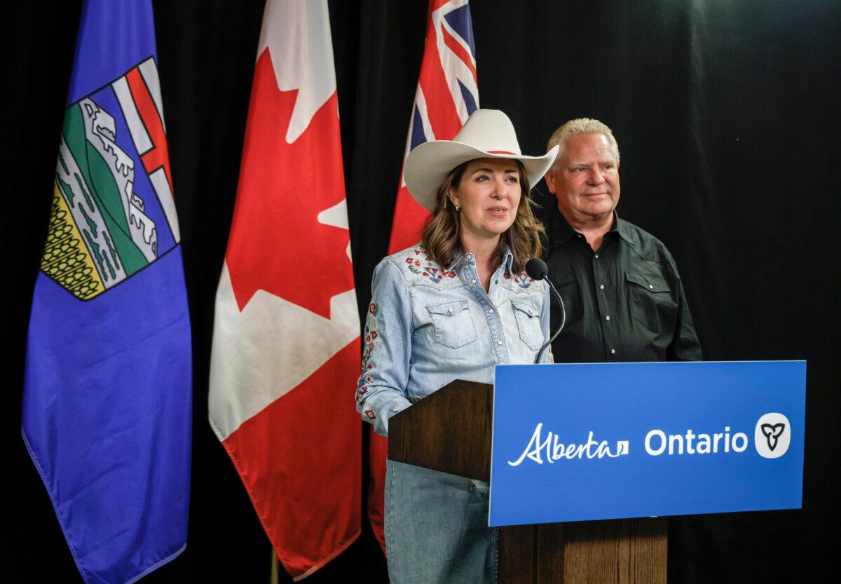 Alberta Premier Danielle Smith and Ontario Premier Doug Ford speak before signing agreements to build new energy and trade infrastructure, in Calgary on July 7, 2025. (The Canadian Press/Jeff McIntosh)
