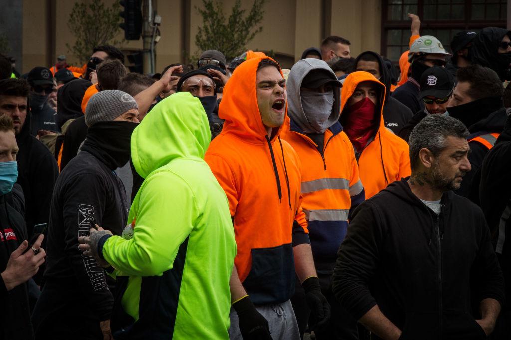 A man yells at police on Sept. 21, 2021, on Elizabeth Street near the CFMEU office in Melbourne, Australia. (Darrian Traynor/Getty Images)