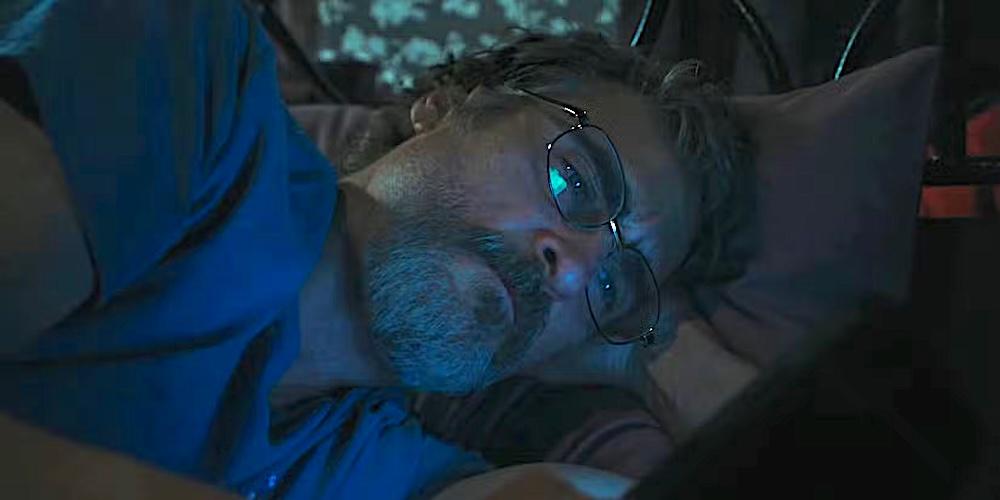 Sheriff Joe Cross (Joaquin Phoenix) doing some late night doom-scrolling in "Eddington." (A24)