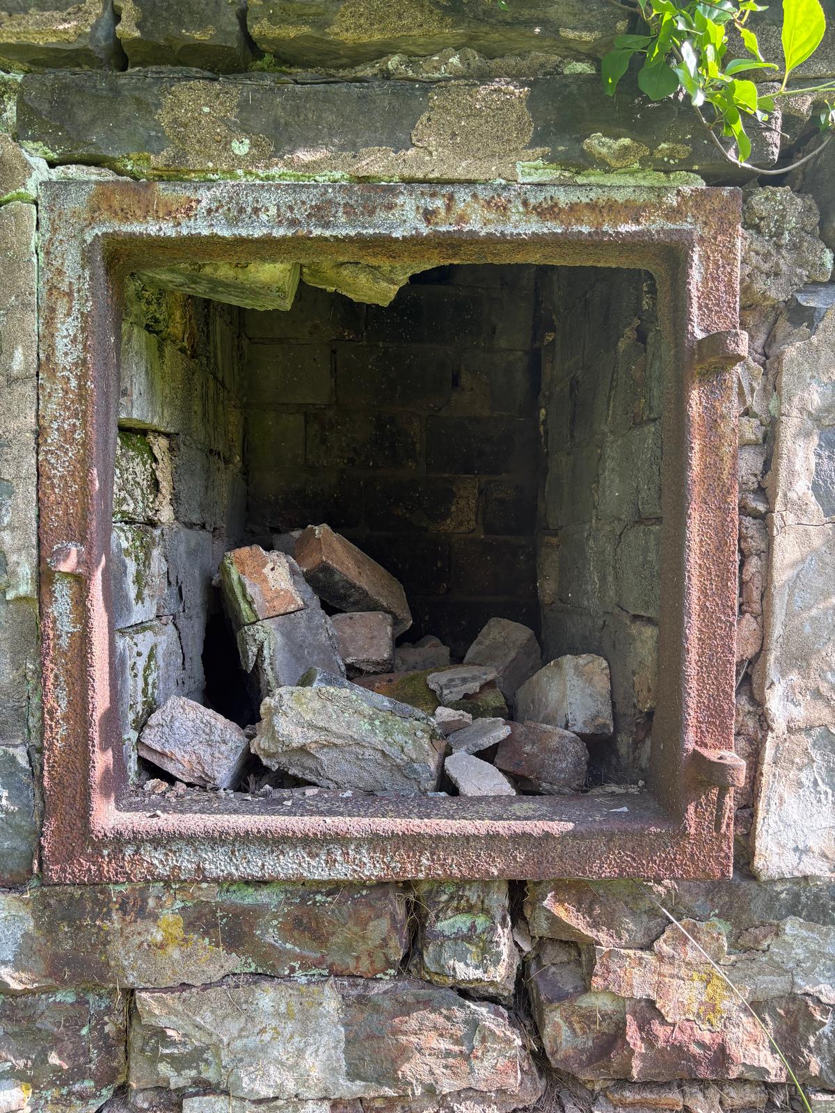 The opening to a furnace is still preserved. (Deena Bouknight)