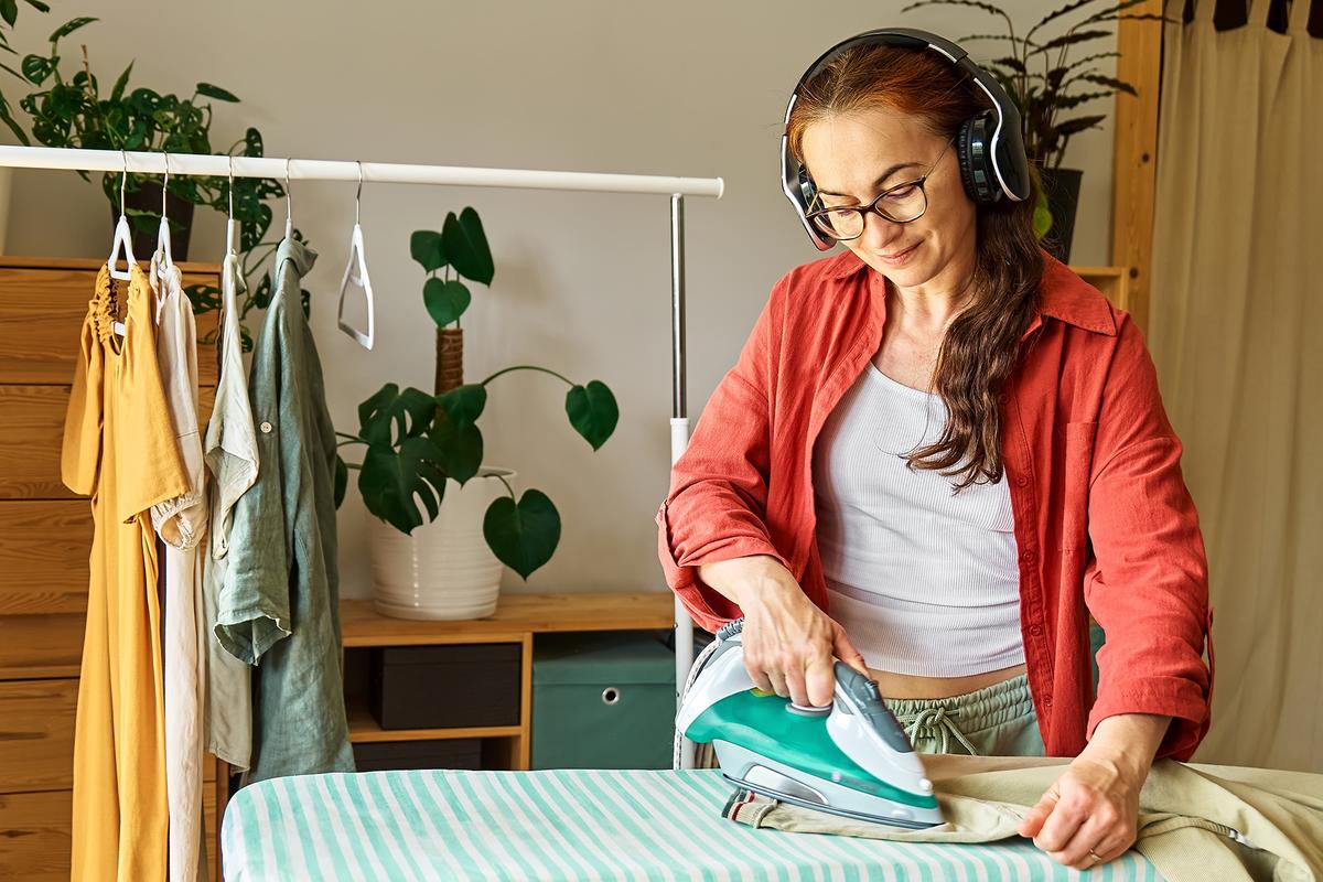 Pairing cleaning tasks with podcasts or audiobooks can make even the most mundane chores more enjoyable. (Caterina Trimarchi/Shutterstock)