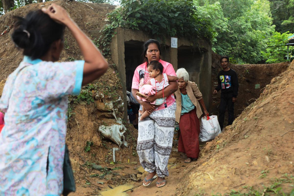 Thai people who fled clashes between Thai and Cambodian soldiers take shelter in Surin province, northeastern Thailand, on Thursday, July 24, 2025. (AP Photo/Sunny Chittawil)