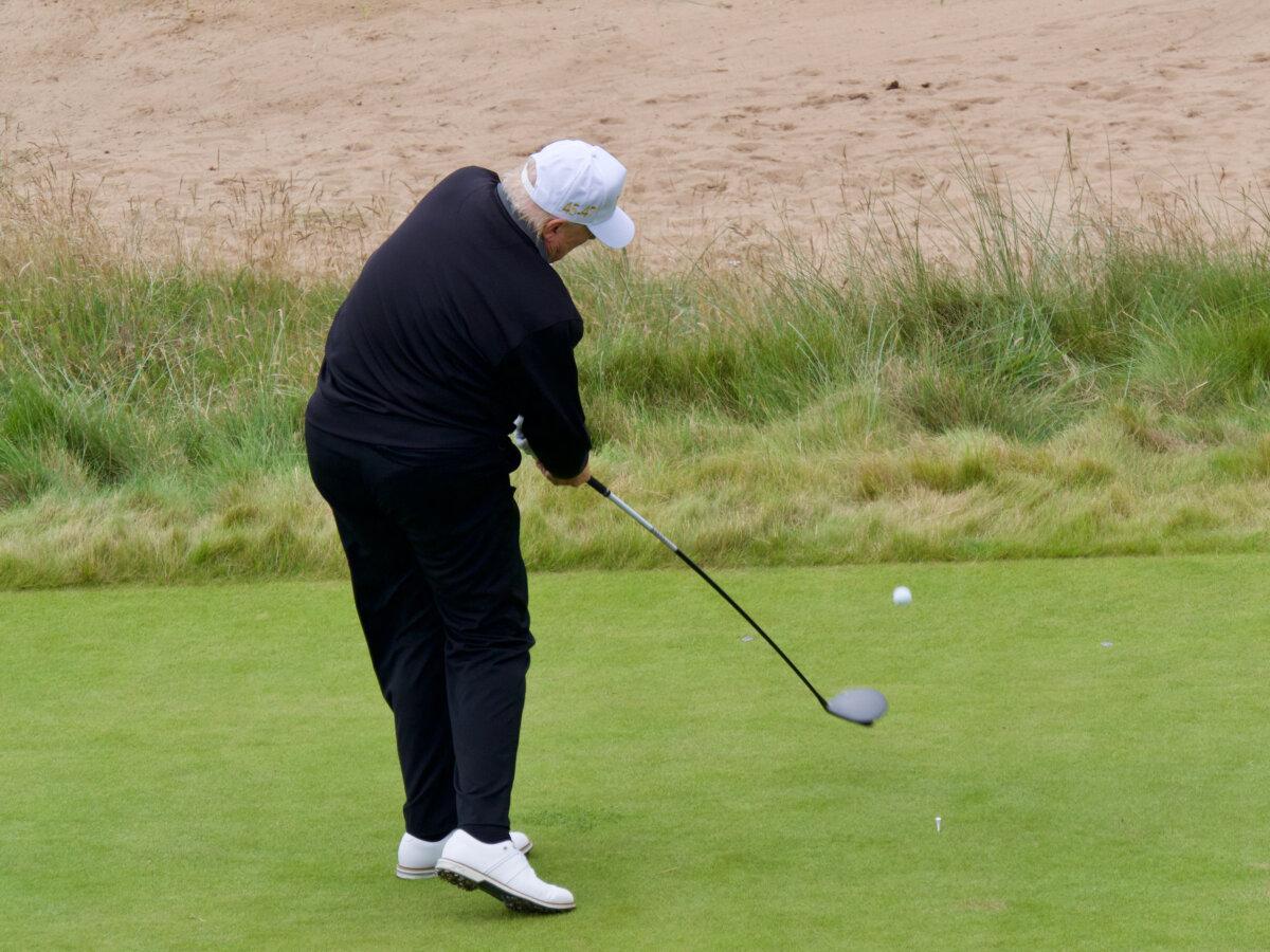 President Donald Trump launches the first tee shot at the grand opening of the New Course at Trump International Golf Links in Aberdeen, Scotland, on July 29, 2025. (Travis Gillmore/The Epoch Times)