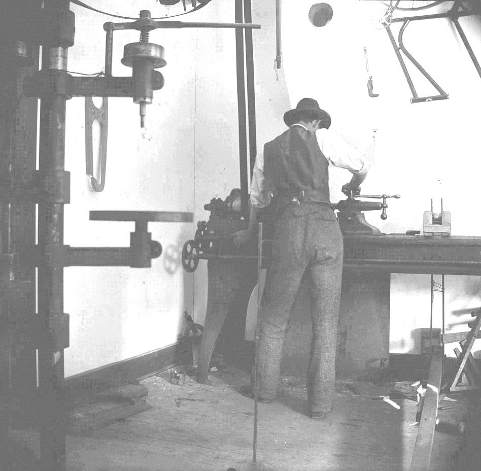 Wilbur Wright working in the Wright brothers' bicycle shop. Library of Congress. (Public Domain)