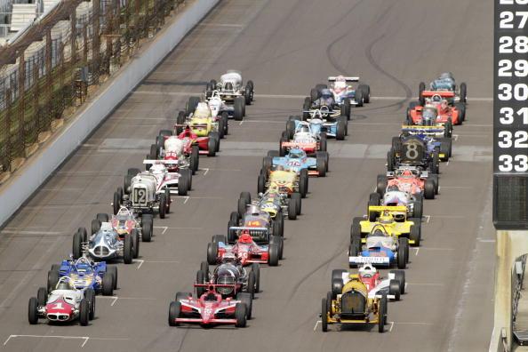 Preparing for the Indianapolis 500’s 100th anniversary on May 29, 2011, 33 of the greatest race cars that won the event line up the previous October at the Indianapolis Motor Speedway. Among those displayed is Ray Harroun’s the Marmon Wasp (Front Row-R). (Ron Hoskins/Getty Images)