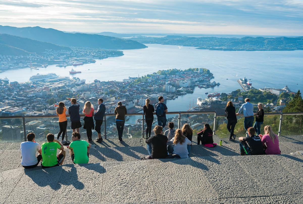 Tourists look out over Bergen from an observation point atop Mount Floyen. (Steve Heap/Shutterstock)