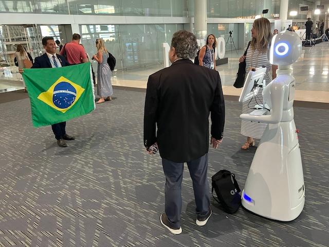 A mobile photo robot snaps a shot of a state deputy from one of Brazil’s 27 unicameral legislative assemblies during the Aug. 4-6 National Conference of State Legislatures’ 2025 Legislative Summit in Boston’s Thomas Michael Menino Convention & Exhibition Center attended by 375 state and provincial lawmakers from 44 countries. (John Haughey/The Epoch Times)