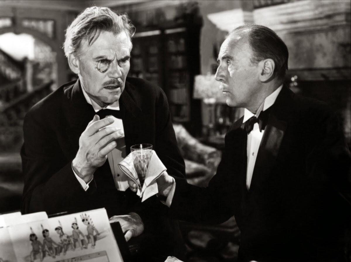 Dr. Edward G. Armstrong (Walter Huston, L) and Detective William Henry Blore (Roland Young), in “And Then There Were None.” (GJW+)