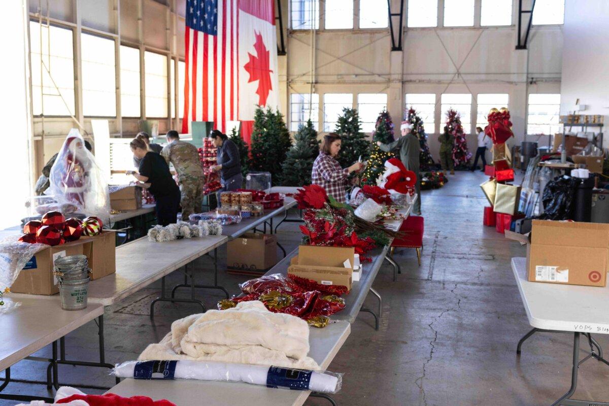Personnel from NORAD and U.S. Northern Command helped set up the NORAD Tracks Santa Operations Center in Hangar 123 on Peterson Space Force Base, Colorado, Dec. 13, 2024. (Public Domain)