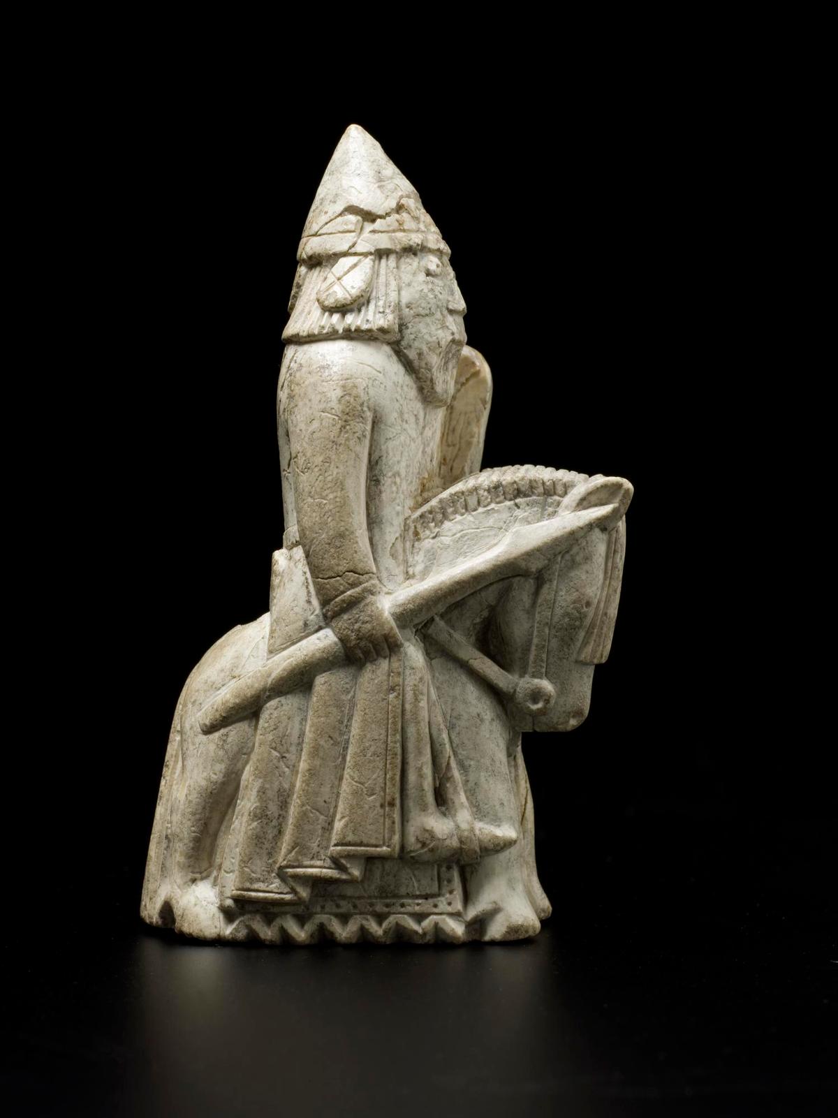 A knight from the Lewis Chessmen, 12th century, made in Scandinavia and discovered on the Isle of Lewis. Sperm whale tooth. The knight is mounted on a horse and holds a spear in the right hand and a shield in the left. (<a href="https://commons.wikimedia.org/wiki/Category:NMS_Collection_of_Lewis_Chessmen" target="_blank" rel="nofollow noopener">National Museums Scotland</a>/<a href="https://creativecommons.org/licenses/by-sa/4.0/deed.en" target="_blank" rel="nofollow noopener">CC BY-SA 4.0</a>)