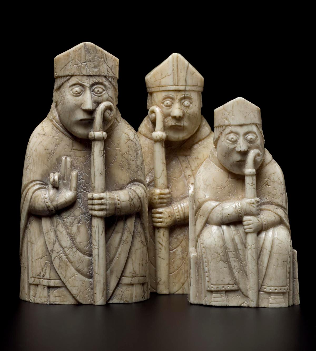 Three bishops from the Lewis Chessmen set, 12th century, made in Scandinavia and discovered on the Isle of Lewis. Walrus ivory. (<a href="https://commons.wikimedia.org/wiki/Category:NMS_Collection_of_Lewis_Chessmen" target="_blank" rel="nofollow noopener">National Museums Scotland</a>/<a href="https://creativecommons.org/licenses/by-sa/4.0/deed.en" target="_blank" rel="nofollow noopener">CC BY-SA 4.0</a>)