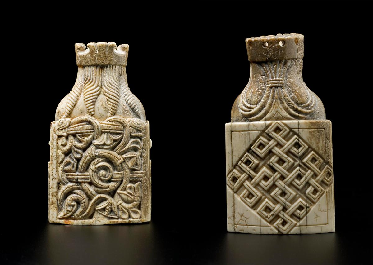 The back of the king's throne (L) and back of the queen's throne from the Lewis Chessmen set, 12th century, made in Scandinavia and discovered on the Isle of Lewis. Walrus ivory. (<a href="https://commons.wikimedia.org/wiki/Category:NMS_Collection_of_Lewis_Chessmen" target="_blank" rel="nofollow noopener">National Museums Scotland</a>/<a href="https://creativecommons.org/licenses/by-sa/4.0/deed.en" target="_blank" rel="nofollow noopener">CC BY-SA 4.0</a>)