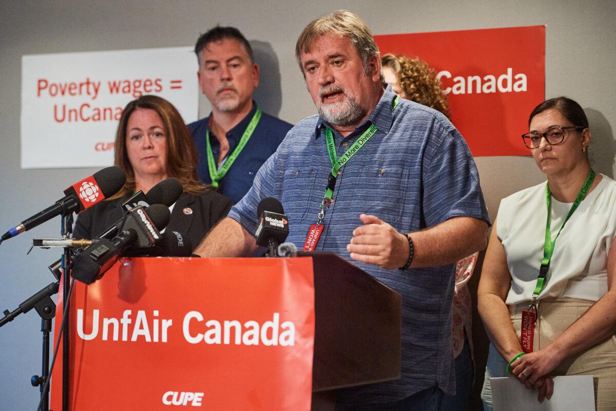 CUPE National President Mark Hancock speaks at a press conference outside the Pearson Airport in Toronto on Aug. 18, 2025. (The Canadian Press/Sammy Kogan)