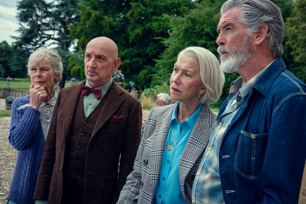 (L–R) Joyce Meadowcroft (Celia Imrie), Ibrahim Arif (Ben Kingsley), Elizabeth Best (Helen Mirren), and Ron Ritchie (Pierce Brosnan) solve a murder, in “The Thursday Murder Club.” (Netflix)