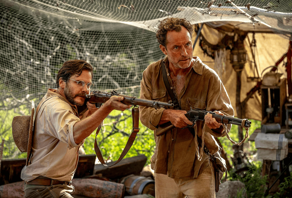 <span class="BxUVEf ILfuVd" lang="en"><span class="hgKElc">Heinz Wittmer (Daniel Brühl, L) and </span></span>Friedrich Ritter (Jude Law) have had quite enough of the Baroness's devious antics, in "Eden." (Vertical/Jasin Boland)