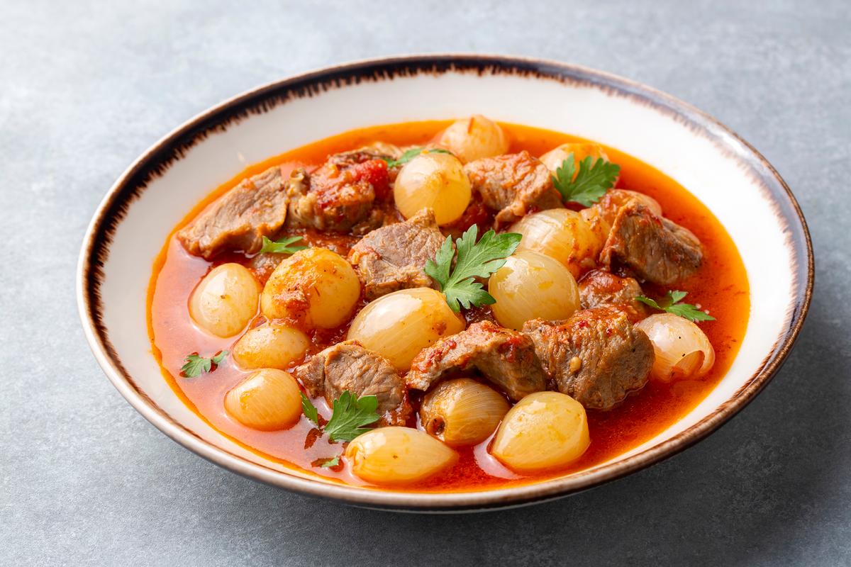 Beef is simmered with root vegetables until everything becomes tender, creating a warm and hearty stew. (Esin Deniz/Getty Images)