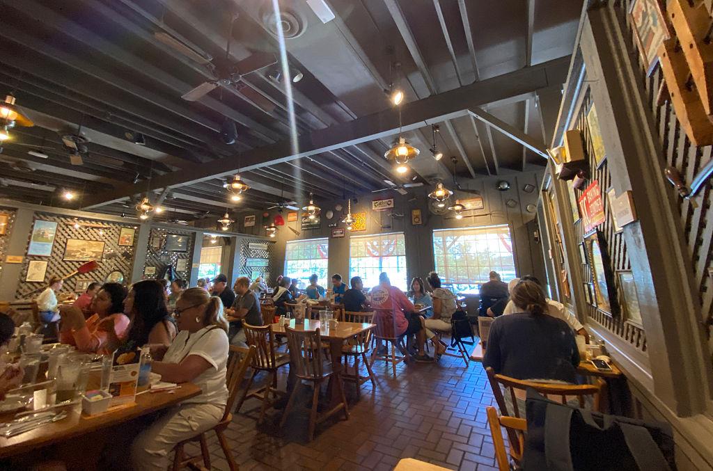 Customers enjoy food at the Cracker Barrel Old Country Store in Mount Arlington, N.J., on Aug. 22, 2025. Cracker Barrel has a special place in the hearts of many Americans, offering country cuisine in a folksy "Old Country Store" setting complete with rocking chairs and occasional country music performances. (Gregory Walton/AFP via Getty Images)