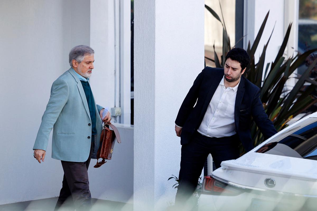 Iranian Ambassador to Australia Ahmad Sadeghi (L) walks toward his car within the grounds of the Islamic Republic of Iran's embassy in Canberra, Australia on Aug. 27, 2025. Australia expelled Iran's ambassador on August 26, accusing the country of being behind antisemitic arson attacks in Sydney and Melbourne. It marks the first time Australia has expelled an ambassador since World War II. (Hilary Wardhaugh/AFP via Getty Images)