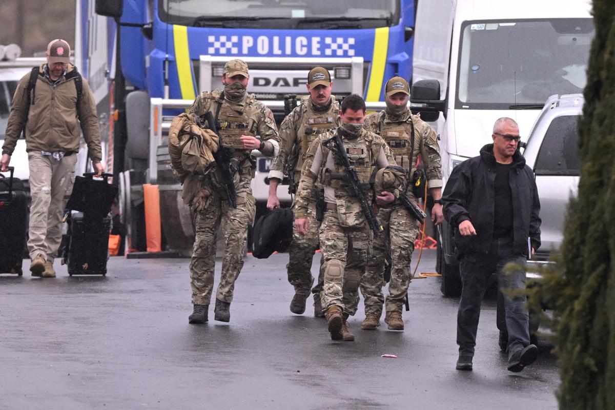 Heavily armed police gather at a police staging point during the search for a fugitive linked to the murder of two police officers, in Porepunkah, in northeast Victoria, Australia, on Aug. 28, 2025. (William West/AFP via Getty Images)
