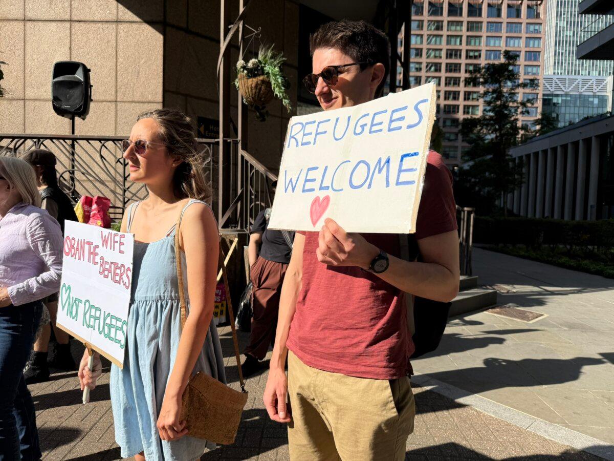 Protesters outside Britannia Hotel in Canary Wharf, East London, on Aug. 8, 2025. (Evgenia Filimianova/The Epoch Times)
