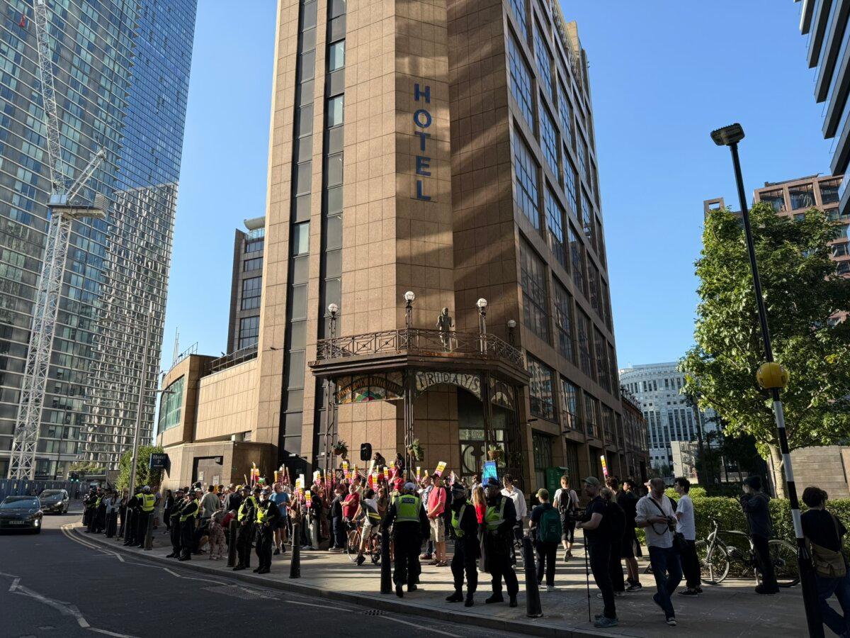 Protesters outside Britannia Hotel in Canary Wharf, East London, on Aug. 8, 2025. (Evgenia Filimianova/The Epoch Times)