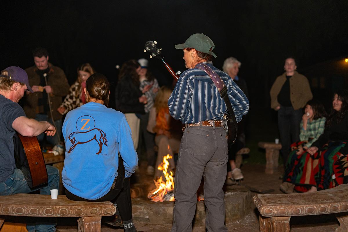 Wednesday evenings mean campfire night at Circle Z Range, where wrangler Johnny leads the group in campfire songs. (Courtesy of Circle Z Ranch)