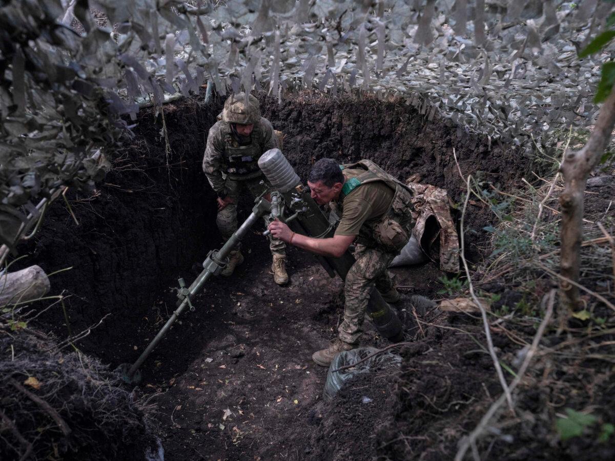 Soldiers fire a mortar toward Russian troop positions near Kostyantynivka, Donetsk region, Ukraine, on Aug. 26, 2025, in this photo provided by Ukraine's 93rd Kholodnyi Yar Separate Mechanized Brigade press service. (Iryna Rybakova/Ukraine's 93rd Mechanized Brigade via AP)
