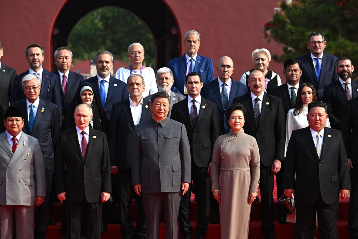 In this pool photograph distributed by the Russian state agency Sputnik, (front row L-R) Indonesia's President Prabowo Subianto, Russia's President Vladimir Putin, the CCP's leader Xi Jinping and his wife Peng Liyuan, North Korea's leader Kim Jong Un, and former Victorian Premier Daniel Andrews in the top right, pose for a photograph before a military parade marking the 80th anniversary of the end of the Second Sino-Japanese War and the end of World War II, in Beijing's Tiananmen Square on Sept. 3, 2025.<br/>(Sergey Bobylev/Pool/AFP via Getty Images)