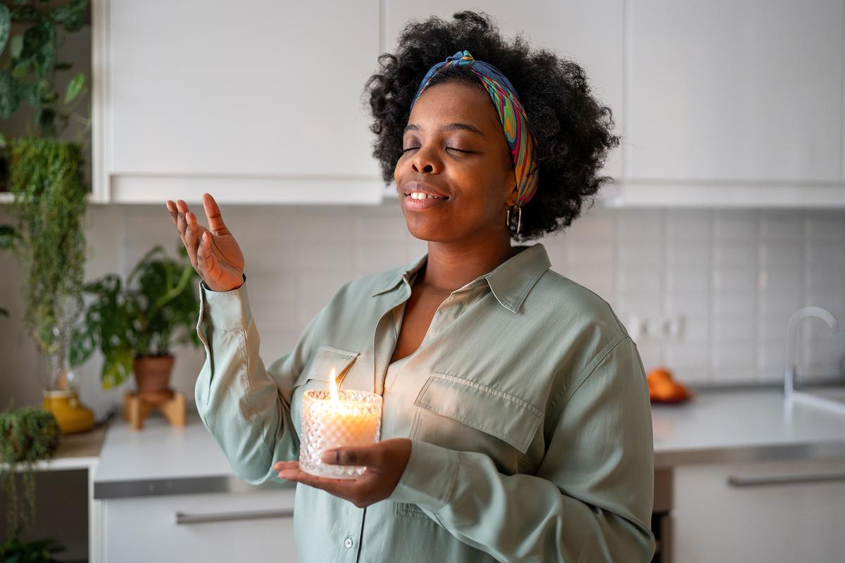 Scented candles can both improve a home's aroma and add to the holiday atmosphere. (yourphotopie/Shutterstock)