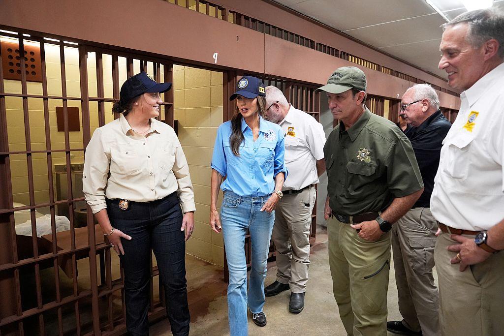 U.S. Homeland Security Secretary Kristi Noem (2nd L) tours "Camp 57," a facility to house immigration detainees at the Louisiana State Penitentiary in Angola, Louisiana, with Louisiana Gov. Jeff Landry (3rd L) and ICE Deputy Director Madison Sheahan (L) on Sept. 3, 2025. (Gerald Herbert/POOL/AFP via Getty Images)