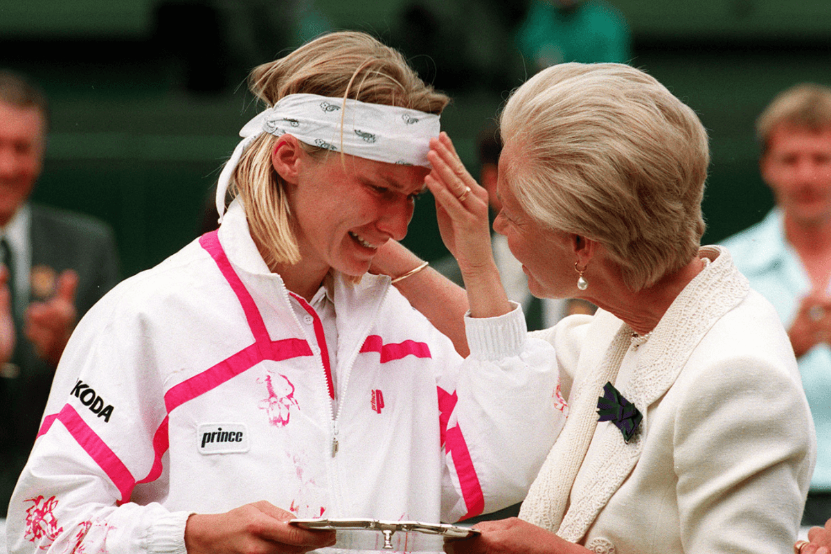 The Duchess of Kent consoles Jana Novotna as she presents her with the runner-up trophy on center court at Wimbledon after she lost 6-7, 6-1, 4-6 to defending champion Steffi Graf, in London, England, on July 3, 1993. (Adam Butler/PA Wire)